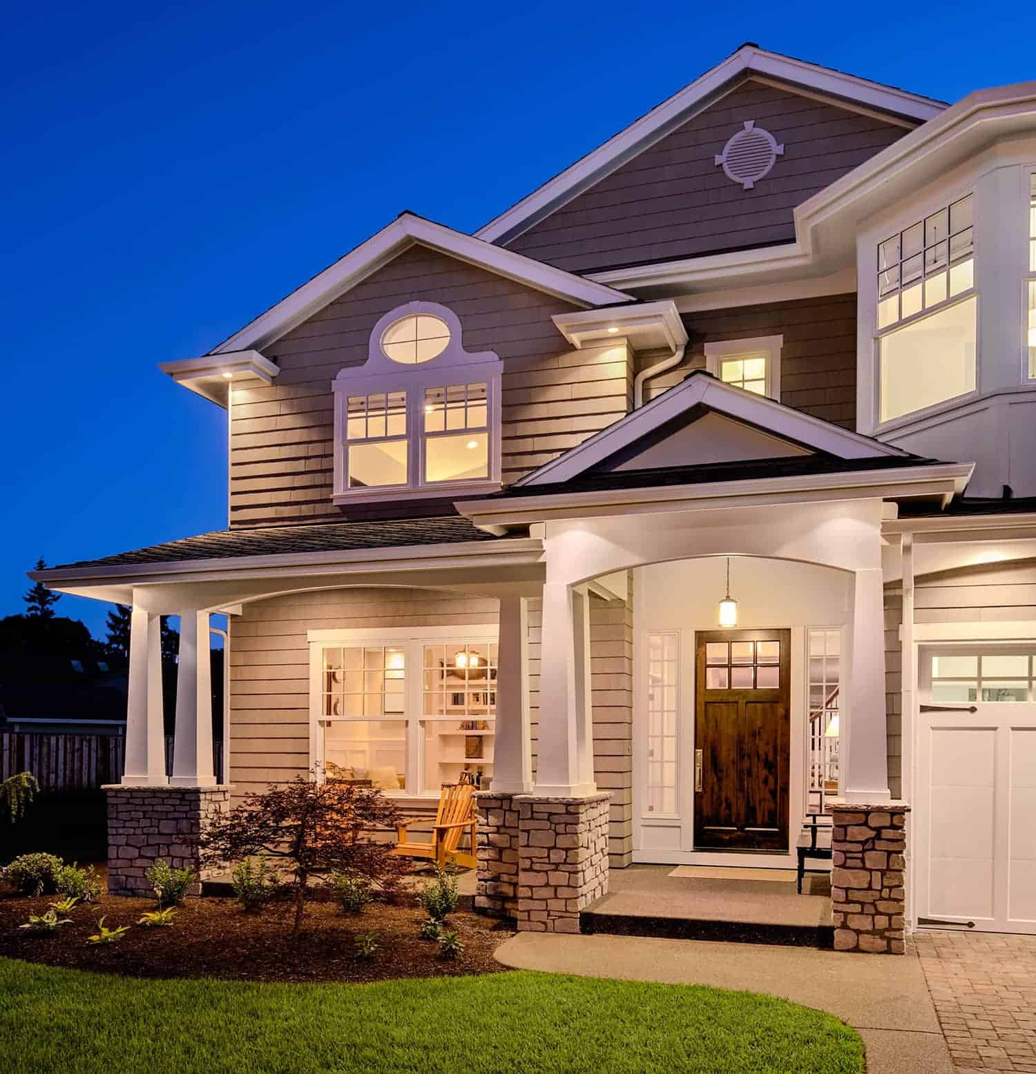 Gray suburban house nighttime